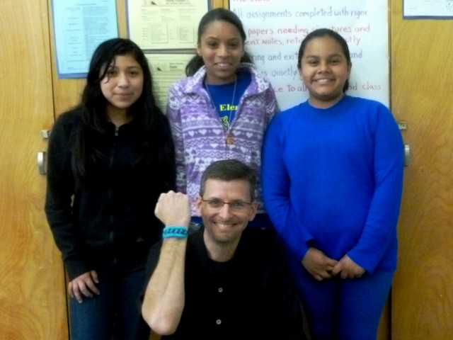 Noemi, Vivian, Ashley V., and the author, with the rubber-band bracelet they made him.